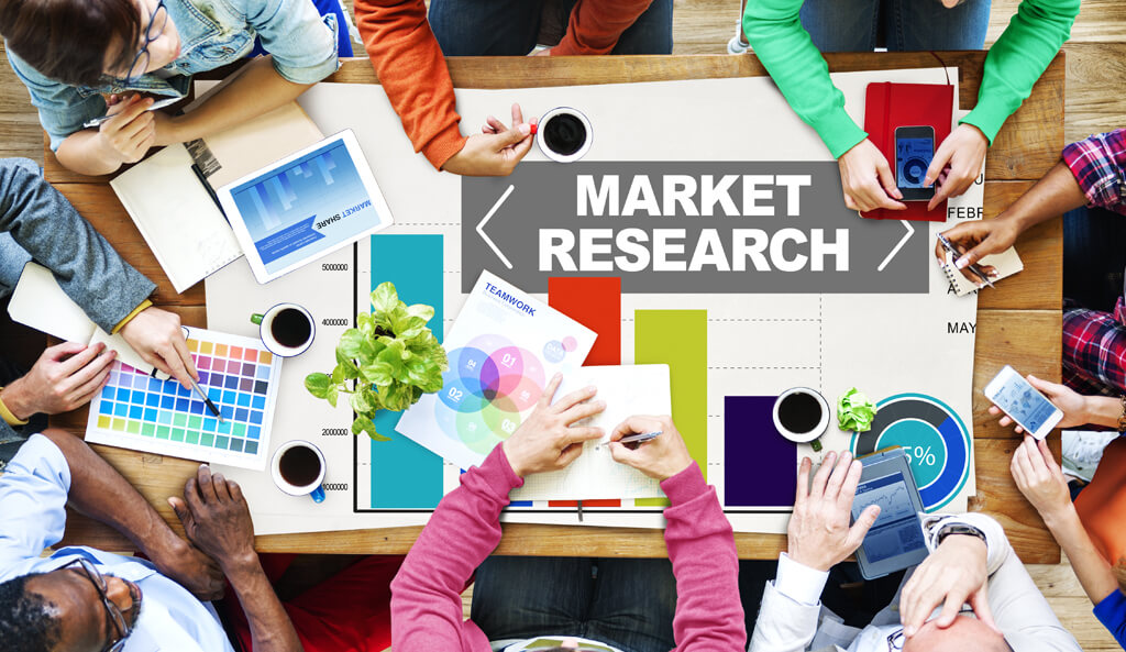  A group of people are conducting market research using various tools and techniques such as surveys, focus groups, and data analysis to gain insights for digital marketing strategies.